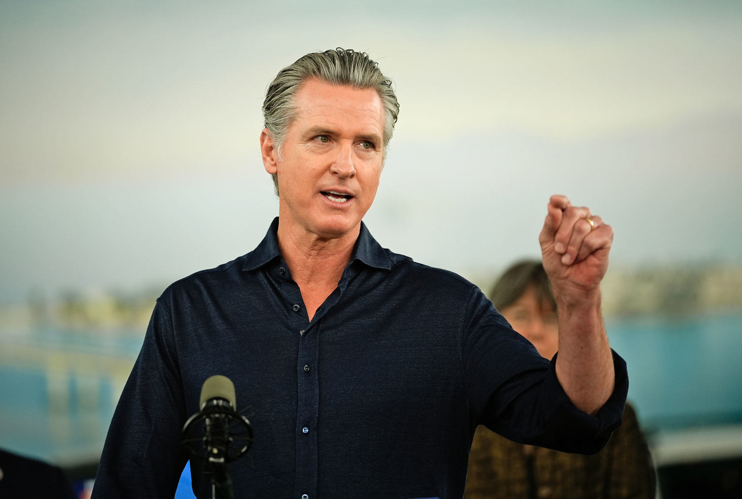 California Governor Gavin Newsom speaks at a podium.
